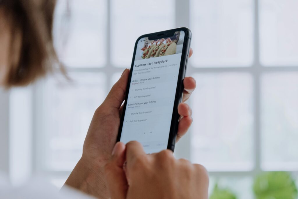 a person ordering in a mobile app powered by pos systems